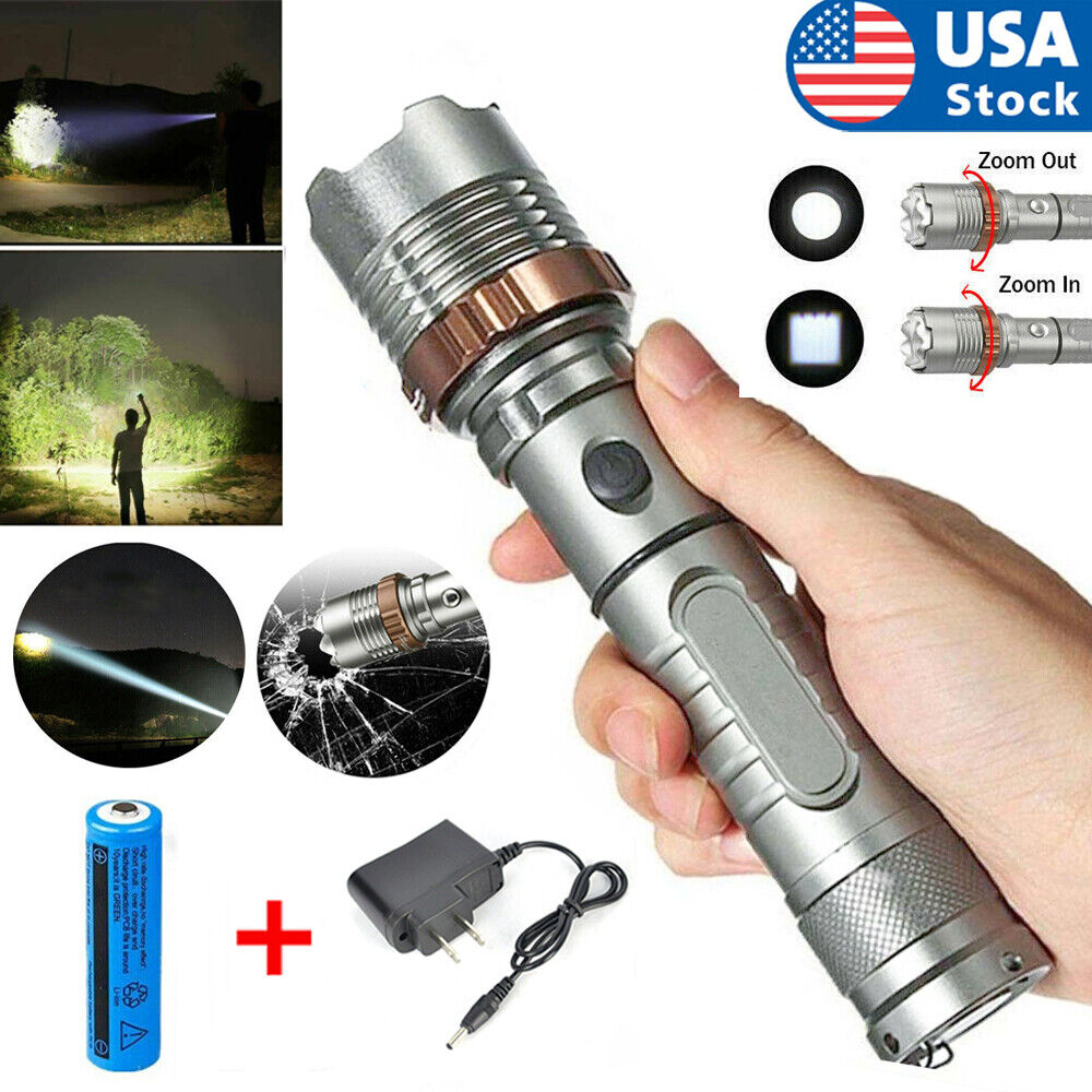 Handheld flashlight with zoom function, battery, and charger