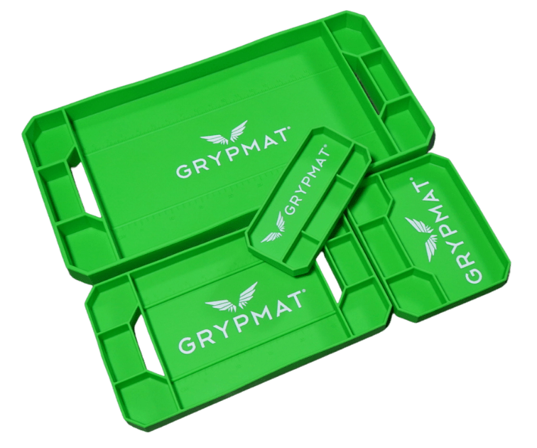 Green GRYPMAT trays on a green background